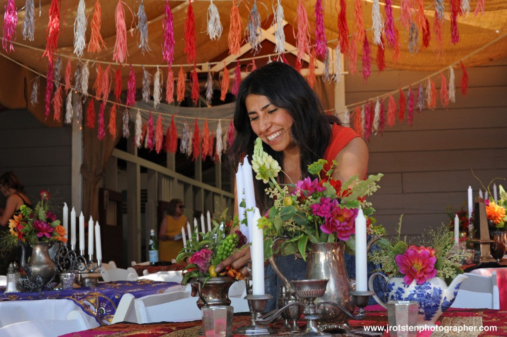 Pilar Zuniga of Gorgeous and Green designing tables at Diablo Ranch for a wedding