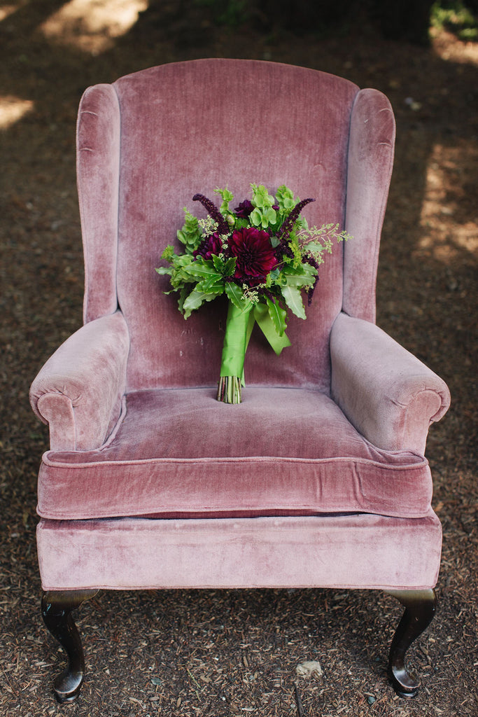 Vintage chair with mossy and dramatic bridal bouquet by Gorgeous and Green