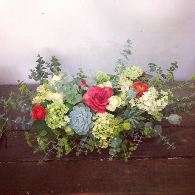 lush green yellow and coral low arrangement by Gorgeous and Green without floral foam